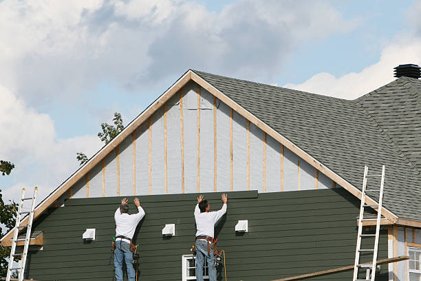 Professional Storm Damage Siding Repair technician working in Shreve, OH
